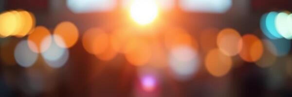 Beautiful sunset creates soft bokeh effect with vibrant orange and blue lights in urban setting during evening hours photo