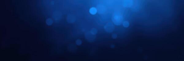 Deep blue background with soft bokeh lighting creating a serene and calming atmosphere photo