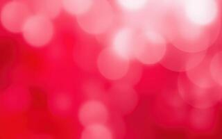 Colorful bokeh background with red and pink hues creating a soft, dreamy atmosphere for artistic projects photo