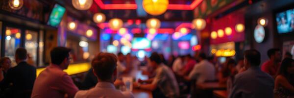 People socialize in a vibrant bar with colorful lights during an evening gathering in a lively urban area photo