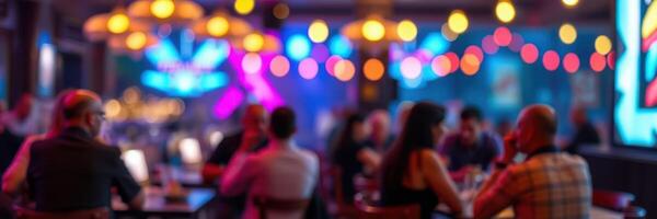 Social gathering in a vibrant bar with colorful lighting during evening hours photo