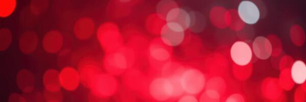 Vibrant red bokeh lights create a festive atmosphere during a celebration event in the evening photo