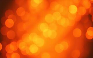 Warm orange bokeh lights create a cozy atmosphere for a celebration or gathering during the evening photo