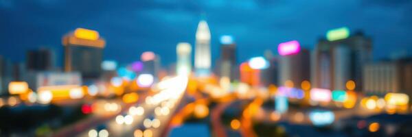 City skyline illuminated at night showcasing vibrant lights and bustling activity along the road photo
