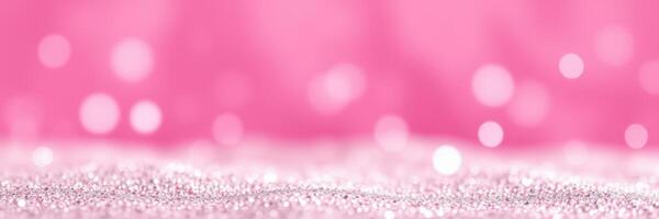 Shimmering pink glitter background with soft bokeh effect creating a dreamy atmosphere photo