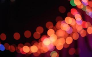 Vibrant bokeh lights create a festive atmosphere during a nighttime celebration in the city photo