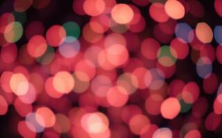 Vibrant abstract light patterns created by blurred colorful bokeh effects at a festive gathering in the evening photo
