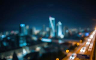 City skyline at night with blurred lights and modern architecture in focus photo