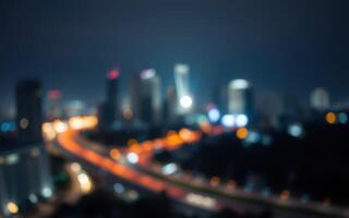 Nighttime city skyline with blurred lights and traffic capturing urban energy photo
