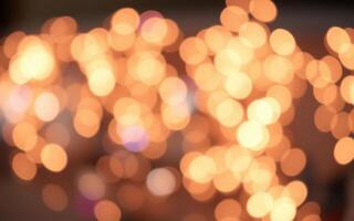 Soft golden lights create a warm ambiance in a festive indoor environment during an evening gathering photo
