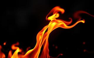 Flames dancing in the darkness, creating mesmerizing patterns and illuminating the area with a warm glow photo