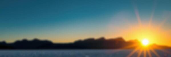 Sunrise over the mountains illuminating the serene landscape at dawn photo