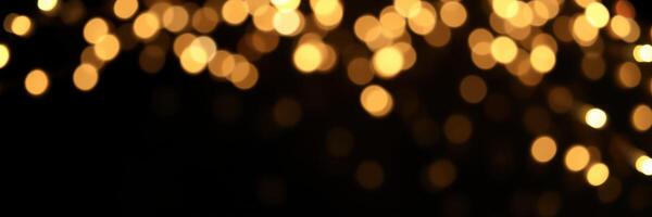 Beautiful golden bokeh lights shimmering against a dark background in a festive and cheerful atmosphere photo