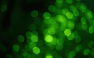 Vibrant green bokeh lights create a magical atmosphere in a nighttime setting filled with soft glimmering reflections photo