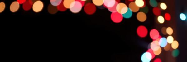Colorful string lights create a festive atmosphere during a holiday celebration at night in a cozy setting photo