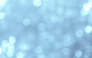 Soft blue bokeh lights create a serene atmosphere in a tranquil setting during early evening hours photo
