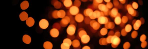 Warm orange light bokeh creates a cozy atmosphere during a festive evening celebration photo