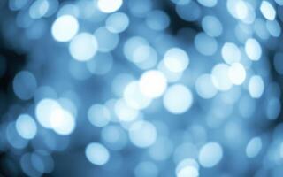 Sparkling blue bokeh lights creating a dreamy atmosphere at an evening event photo