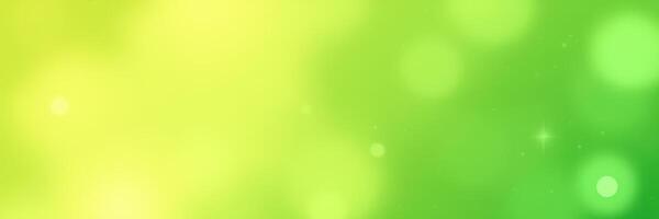 Colorful bokeh background with vibrant green and yellow hues creating a fresh spring atmosphere photo