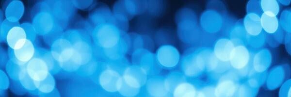 Soft blue bokeh lights creating a calming atmosphere in a dark setting filled with tranquility photo