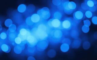 Vibrant blue bokeh creating an ethereal and dreamy atmosphere for artistic backgrounds and designs photo