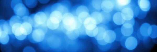 Colorful blue bokeh background illuminating a festive atmosphere during evening celebrations photo