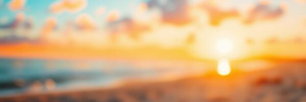Beautiful sunset over the ocean with vibrant colors reflected in the water and clouds above at a sandy beach photo
