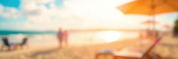 Couples enjoy a romantic walk on a sunlit beach at sunset, with umbrellas and lounge chairs nearby photo