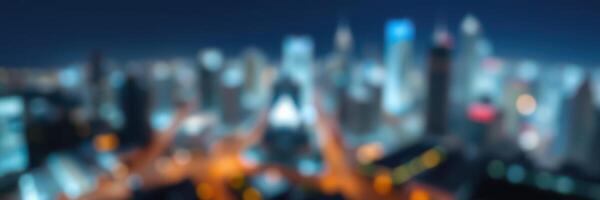City skyline illuminated at night, with blurred lights and buildings creating an urban atmosphere and vibrant energy photo