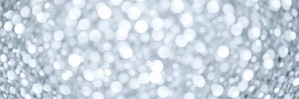 Sparkling light reflections create a dreamy atmosphere with shimmering bokeh effects at a festive gathering photo