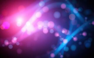 Vibrant light trails and floating bokeh create a dynamic abstract background for artistic expression photo