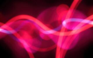 Abstract light waves in vibrant colors creating a mesmerizing visual effect in a dark background setting photo