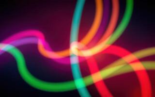 Vibrant light trails create an abstract display of colors on a dark background in a creative artistic representation photo