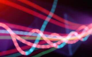 Colorful light trails create dynamic patterns in a vibrant abstract display at night photo