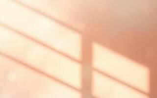 Soft sunlight creates gentle shadows on a warm-colored wall in a cozy indoor space during the afternoon photo
