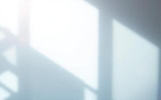 Soft sunlight streaming through a window creates delicate shadows on a wall in a tranquil indoor space photo
