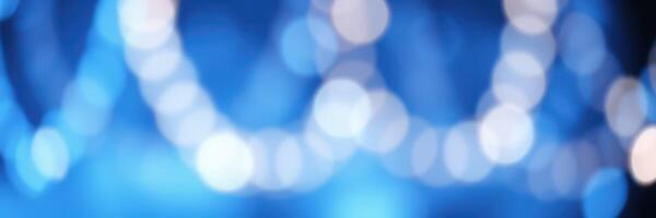 Vibrant blue lights create a dreamy atmosphere in a festive setting during an evening celebration photo