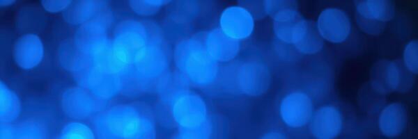 Abstract blue bokeh background rendering a vibrant and soothing atmosphere perfect for design projects photo