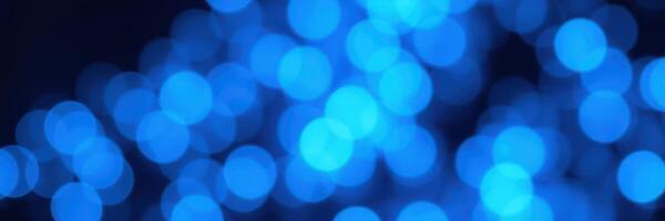 Vibrant blue bokeh lighting creates a captivating and serene atmosphere in an indoor setting photo