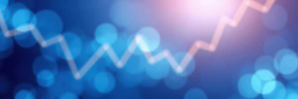 Dynamic upward trend displayed through a blurred blue background with light effects representing market growth and analysis photo