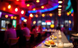 Vibrant nightlife atmosphere in a crowded bar featuring colorful lights and delicious appetizers photo