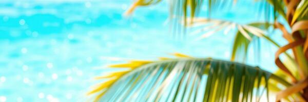 Bright tropical oasis with palm fronds swaying by the vibrant blue ocean during a sunny day photo