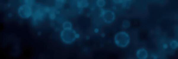 Bubbles floating in deep blue water create a tranquil underwater atmosphere photo