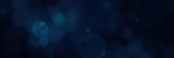Dramatic blue and black abstract background with soft bokeh lights creating a dreamy atmosphere photo