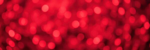 Vibrant red bokeh lights create a festive atmosphere during a celebration event in the evening photo