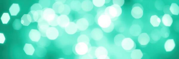 Stunning teal bokeh background creates a vibrant atmosphere for creative design projects and presentations photo