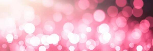 Soft pink glitter background with bokeh effects for creative designs and festive themes photo