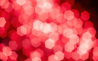 Red bokeh lights create a vibrant atmosphere in a festive environment during evening celebrations photo