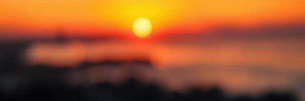 Vibrant sunset overlooking a serene ocean landscape during twilight hours on a warm evening photo