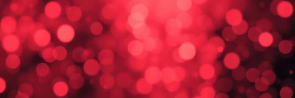 Glowing red bokeh lights create a festive atmosphere during night celebrations in urban settings photo